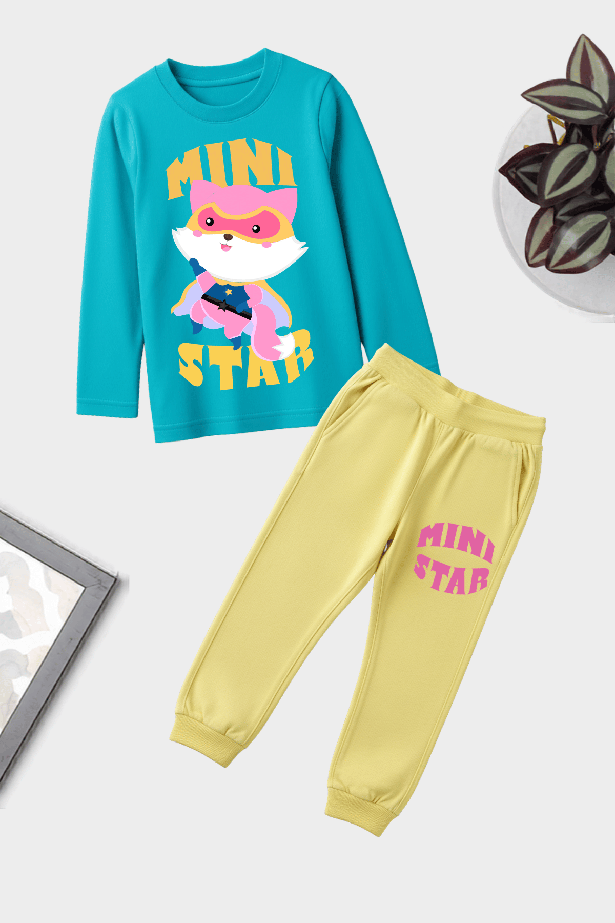 Unisex kids mini star theme jogger set made from soft cotton, featuring adorable star prints for everyday comfort.
