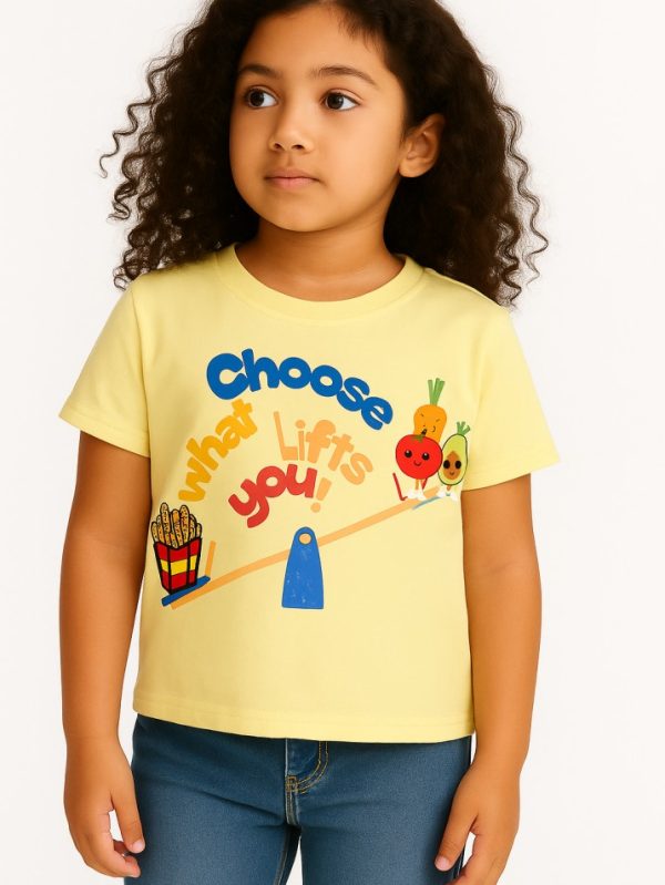 Yellow kids’ t-shirt with “Choose What Lifts You” print featuring cute veggies and fries — fun healthy habits design for toddlers and kids.