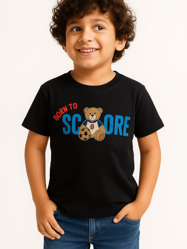 Black kids’ t-shirt with cute teddy bear football print and text “Born to Score” – sporty cotton tee for boys.