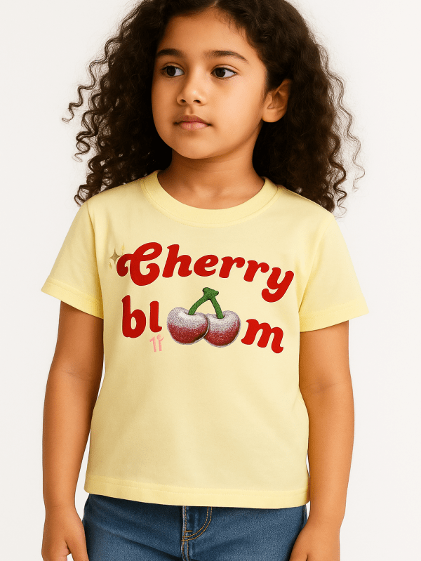 Yellow kids’ t-shirt with cute glitter cherry print and “Cherry Bloom” text – soft cotton summer wear for girls.